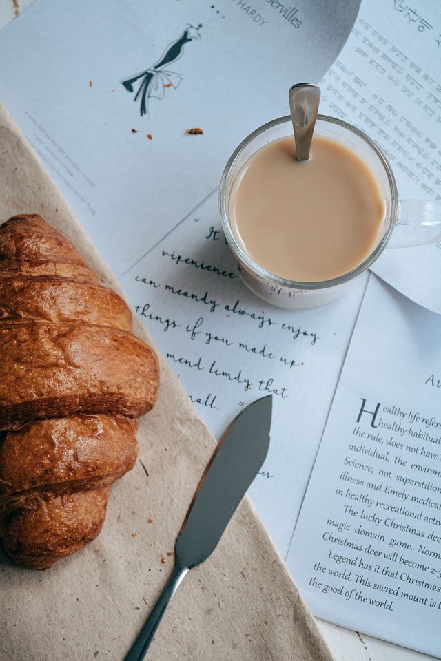 Coffee, a croissant and an open book on a quiet Saturday morning, the gift of free time