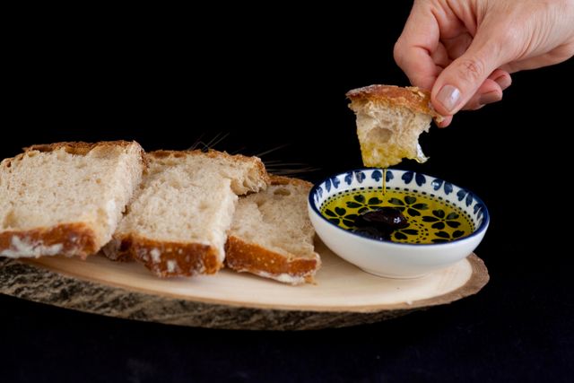 Bread dipped in a bowl of good extra virgin olive oil, a consumable Christmas gift she will use up